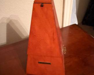 Wooden pyramid metronome in orange finish