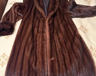 Full-length dark brown mink fur coat with shawl collar