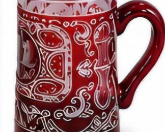 Decorative red mug with intricate white Southwestern-style pattern.