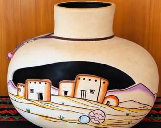 Pueblo-style pottery vase with hand-painted Southwestern design.
