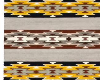 Southwestern woven rug with gray background and geometric bands in yellow, black, brown and cream.