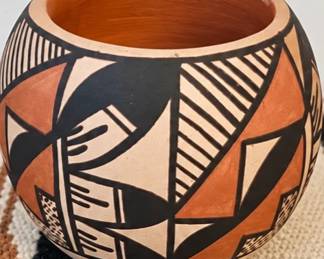 SW pottery bowl with black and terracotta geometric design.