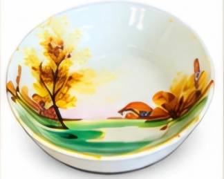 Decorative bowl featuring a colorful Southwestern landscape scene.