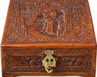 Ornately carved wooden box with latch