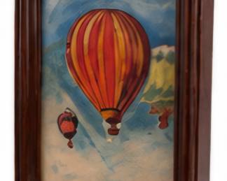 Framed hot air balloon artwork.