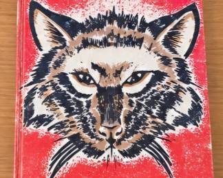 Vintage illustrated book with a bold red cover featuring a large wildcat portrait.
