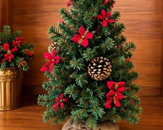 Tabletop Christmas tree with red bows, poinsettias & pinecones- all artificially made for you!