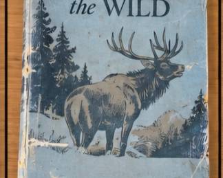 Vintage The Call of the Wild by Jack London, illustrated blue cover featuring a woodland elk scene