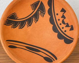 Southwestern terracotta plate with hand-painted geometric design