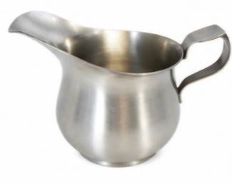 Stainless steel creamer with curved handle and pouring spout.