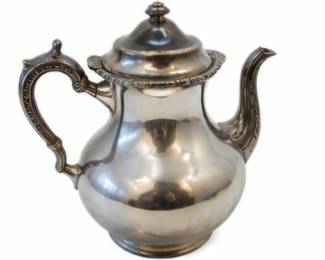 Vintage silver-tone teapot with ornate handle and spout.