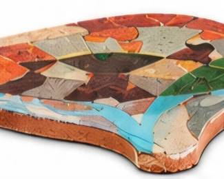 Large colorful animal-shaped decorative piece with a mosaic-style geometric design.