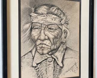 Framed detailed pencil portrait of an elderly Native American man wearing a patterned headband.