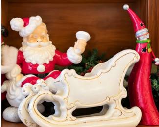 Santa figurines with decorative white Christmas sleigh