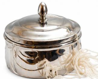 Silver-tone covered serving dish with decorative tassel.