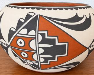 Southwestern pottery bowl with bold black, terracotta and cream geometric design.