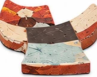 Small grouping of colorful geometric decorative pieces in rustic earth tones