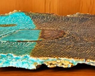 Turquoise and earth-tone decorative slab with textured finish.