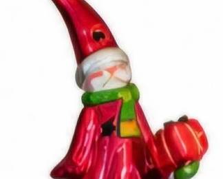 Tall red Santa/gnome figure.