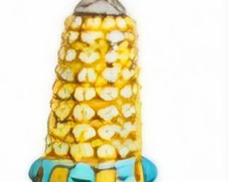 Small colorful beaded corn-shaped decorative piece.