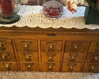 Antique oak 15 drawer card file cabinet currently being used as a coffee table. Excellent