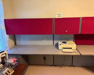 10' long L-shaped modular office system with full length red upper cabinets, grey laminate desks and grey fabric privacy panels...excellent