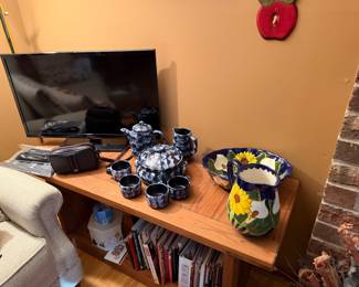 Small flatscreen TV and decorative pottery