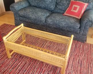 Cozy couch; coffee table; area rug