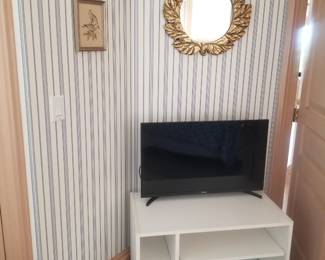 Decorative mirror; TV; bookcase