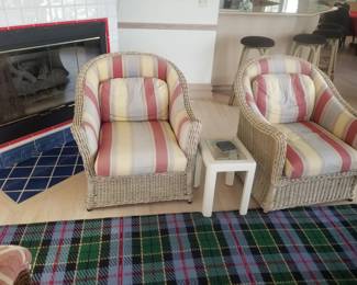 Matching arm chairs; cocktail table; large plaid area rug