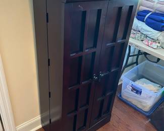 #52 dark wood media cabinet 25x14x48 $50.00
