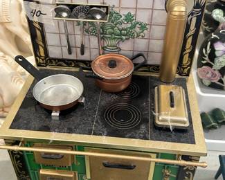 #120 Tin toy stove with accessories 10.5" $40.00