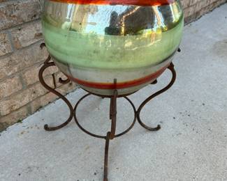#63 Gazing ball with swirl design on stand 21x12 $60.00