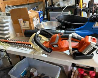 #234 Black and Decker 24" cordless trimmer hedge trimmer battery and charger $25.00