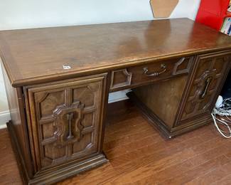 #46 desk with 2 doors, 5 drawers, 1 shelf, as is finish heavy 62x21x32 $150.00