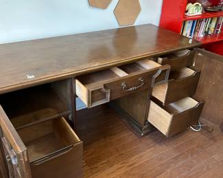 #46 desk with 2 doors, 5 drawers, 1 shelf, as is finish heavy 62x21x32 $150.00