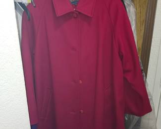 Vintage Pendleton women's wool coat. It features a classic single-breasted, button-front design with a structured shirt collar, clean raglan or set-in shoulders, and side slash pockets. Pendleton is highly regarded for its high-quality 100% virgin wool and wool-blend outerwear crafted in traditional, rich colorways like this vibrant crimson red. Prized for its vibrant jewel-toned palette and classic equestrian-leaning car coat silhouette.