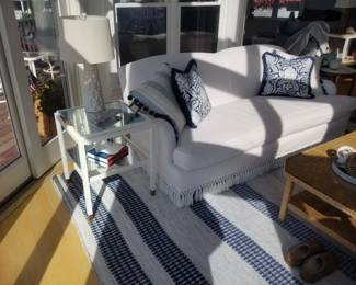 Serena & Lily Miramar English roll sofa; end table; table lamp