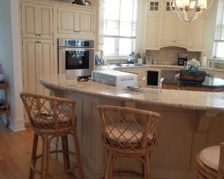 Large Wood-Mode kitchen with an island. Serena & Lily bar stools