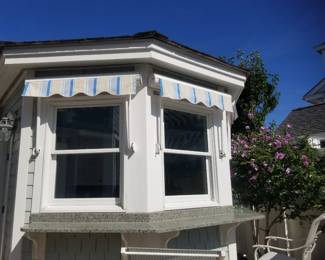 Pool cabana awnings with remote