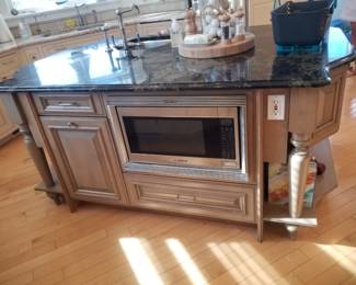 Kitchen island has a trash corral; BOSCH microwave oven