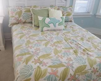 Pretty white queen bed by Lane Furniture; bedding by Eastern Accents