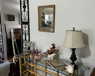 Metal wall art, lamps and unique sofa or accent table.