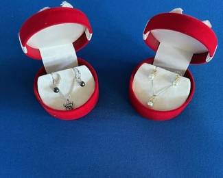 14k black pearl earrings and necklace set and 14k pearl earrings and necklace.