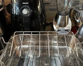 Phillips air fryer, Black and Decker blender and stainless steel roasting pan.