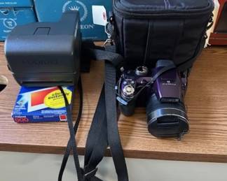 Fujifirm FinePix S-Series camera and Vintage Polaroid OneStep 600 instant film camera.