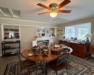 Florida room with nice table & 8 chairs, rugs, dishes, sideboard, stand, etc.