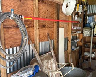 In the shed wheelbarrow, tools, galvanized steel tubs