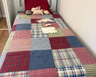 Twin bed with nice quilt