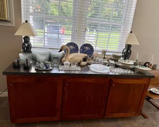 Sideboard, dishes and glass, geese, ducks, lamps